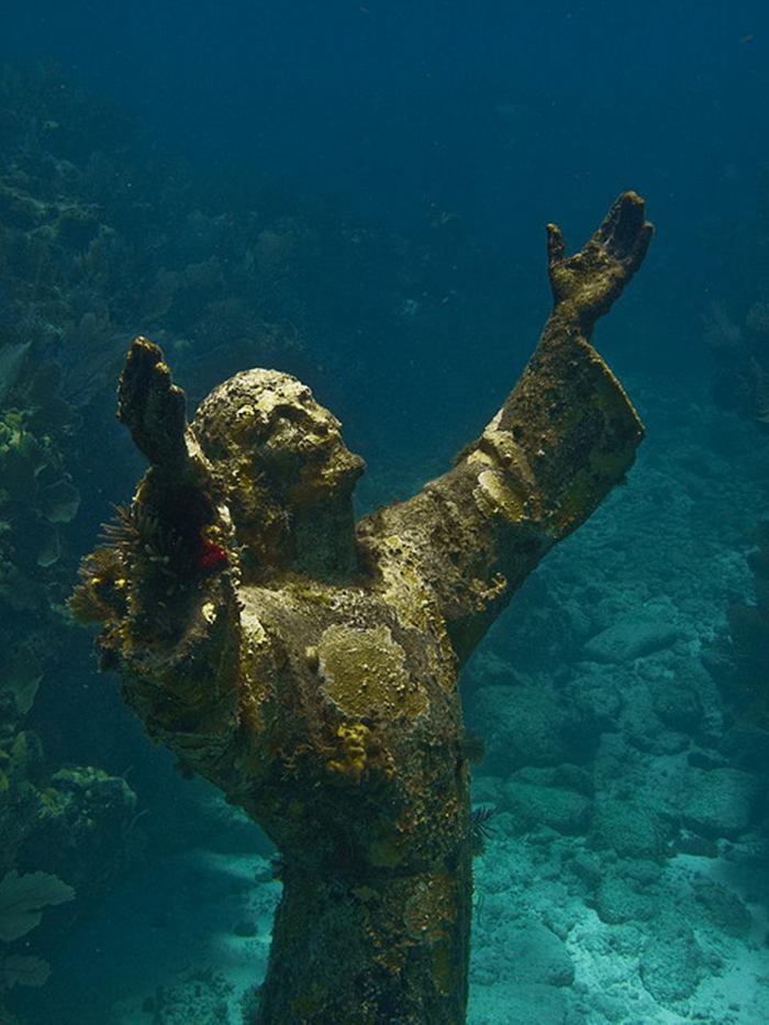 Christ of the Abyss is a submerged bronze statue of Jesus, of which the original is located in the Mediterranean Sea off San Fruttuoso between Camogli and Portofino on the Italian Riviera. It was placed in the water on 22 August 1954 at approximately 17 metres depth, and stands c. 2.5 metres tall. Various other casts of the statue are located in other places worldwide, both underwater and in churches and museums. The sculpture was created by Guido Galletti after an idea of Italian diver Duilio Marcante. The statue was placed near the spot where Dario Gonzatti, the first Italian to use SCUBA gear, died in 1947. It depicts Christ offering a blessing of peace, with his head and hands raised skyward.