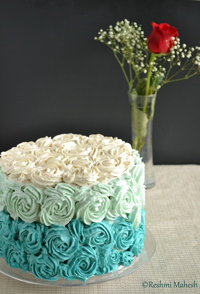 white velvet cake with whipped vanilla blue ombre frosting