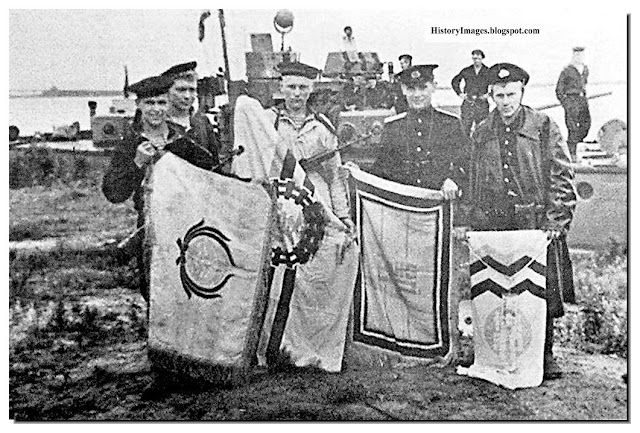 Russian sailors with captured Japanese flags
