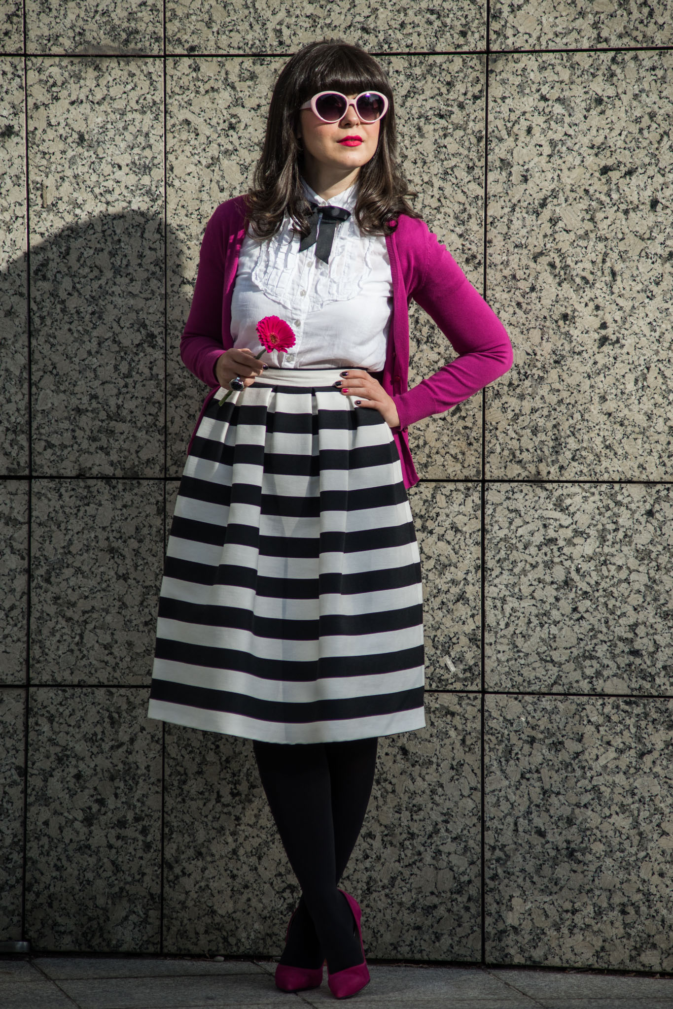 black & white outfit with stripes and pops of pink and fuchsia white shirt black bow tie fuchsia shoes heels sweater C&A striped midi skirt stripes pink thrifted trench black clutch pink cat eye glasses