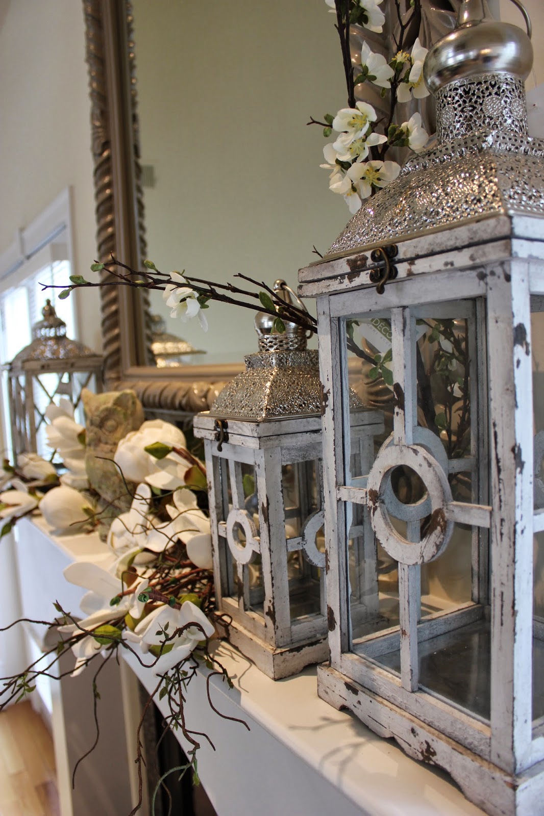 Maison Decor Styling a mantle with lanterns and florals