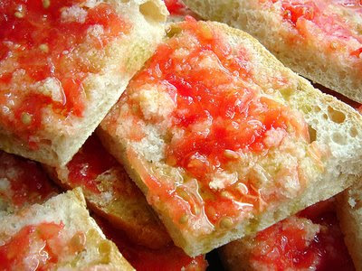 Tomato with garlic on a bread slice