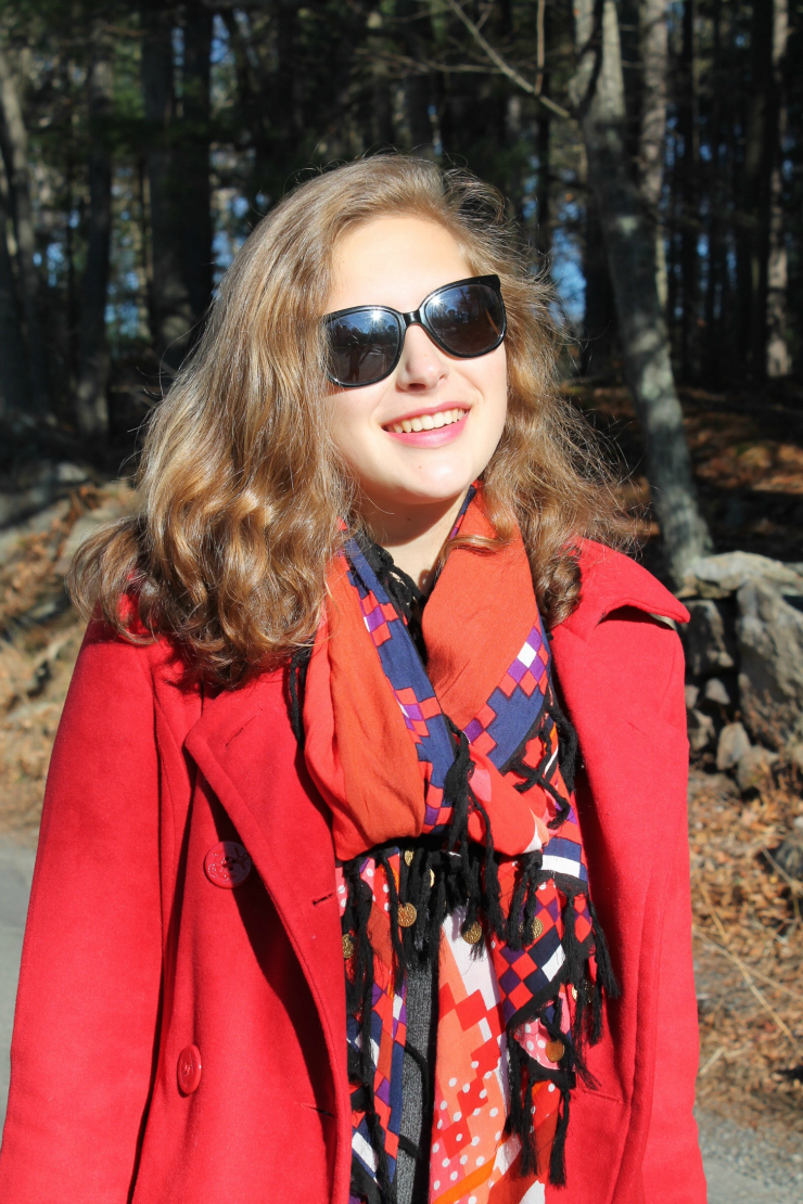 Red peacoat, red lipstick, black skinny jeans