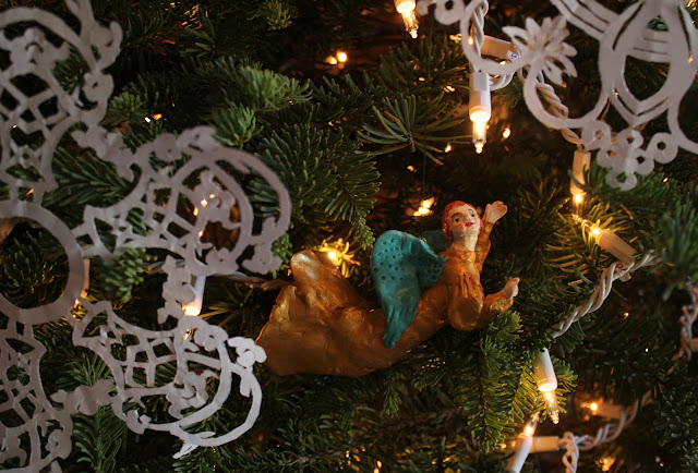 The Angel - Christmas Tree. Sarah Myers Christmas, holiday, tree, snowflakes, decorations, decor, noel, navidad, winter, lights, sparkle, ornament, angel, figures, small, paper, flying, Christ-child, birth, Christmastime, Weihnachten, interior, decor, art, handmade, joy, happiness, ornate, beautiful, handiwork, charm, photography, Sarah Myers, glass, fir, live