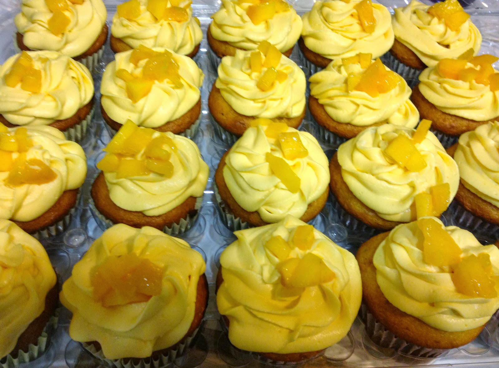 Mango cupcakes filled and frosted with mango cream frosting