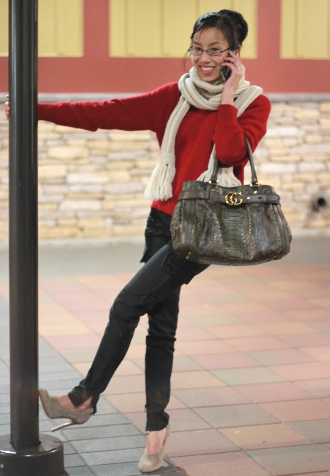red sweater and olive pants outfit trend winter