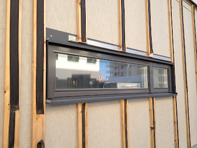 north window in rainscreen before clapboard application 1x3 strapping runners with rubber strip stapled