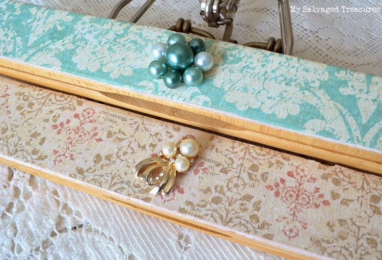 hangers decorated with vintage earrings and craft paper