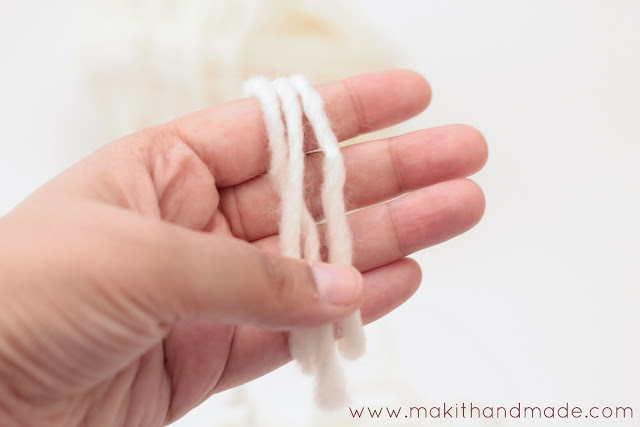 The Perfect Pom Pom Tutorial By Make It Handmade. Learn the secret to making perfect, round, fluffy pom poms and how to secure them so they'll never come off.
