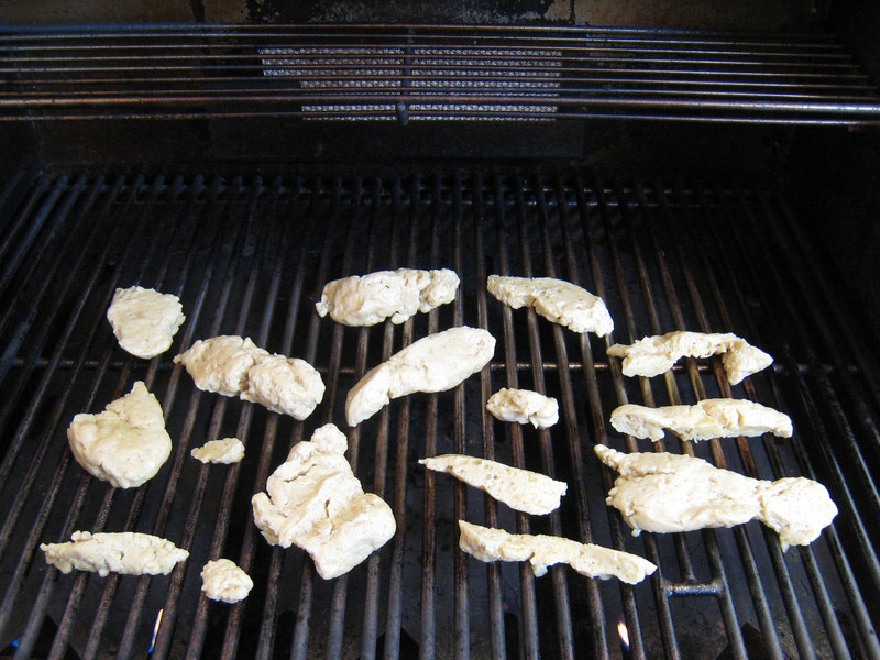 Seitan cutlets placed onto the grill