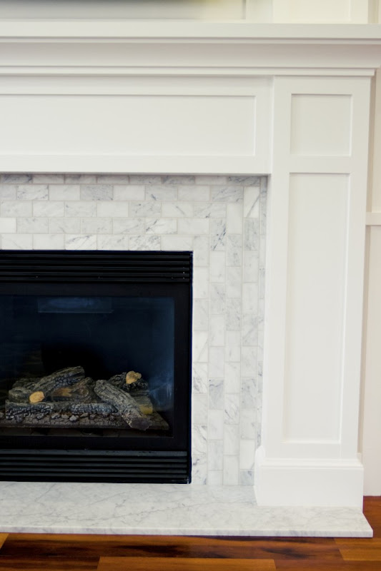 The Granite Gurus Carrara Marble Hearth from MGS by Design