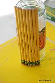 glueing on pencils for a pencil vase