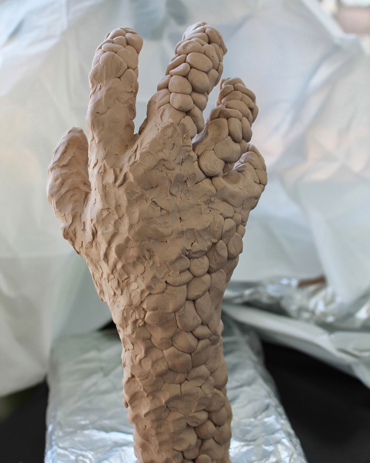 Connecting Pieces Sculpting a Hand out of Sculpy Clay The Wine Grab Sign