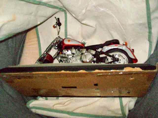 Mattel Barbie Harley Davidson motorcycle on a pillow.