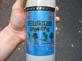 Holding a bottle of Delirium Tremens