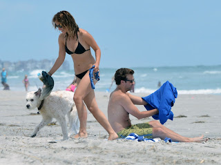 Olivia Wilde and her dog on the beach 