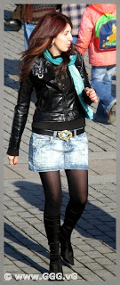 Girl in jean skirt and leather jacket