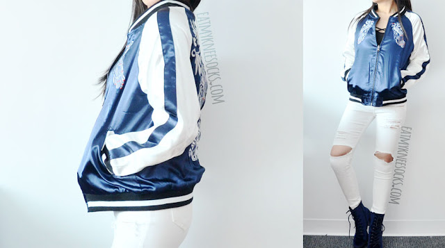 SheIn Fashion Review: Reversible Embroidered Bomber Jacket A sporty-chic outfit featuring SheIn's reversible silk satin embroidered Asian-style bomber baseball jacket, paired with white ripped destroyed high-waisted skinny jeans, blue velvet Report high-heeled booties, and a Brandy Melville-inspired cross-front cropped tank top.