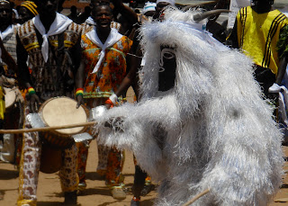 A konkoran, representing a traditional Jola spirit, performed to the delight of young and old.