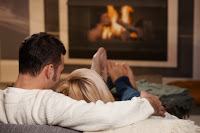 couple in front of fire