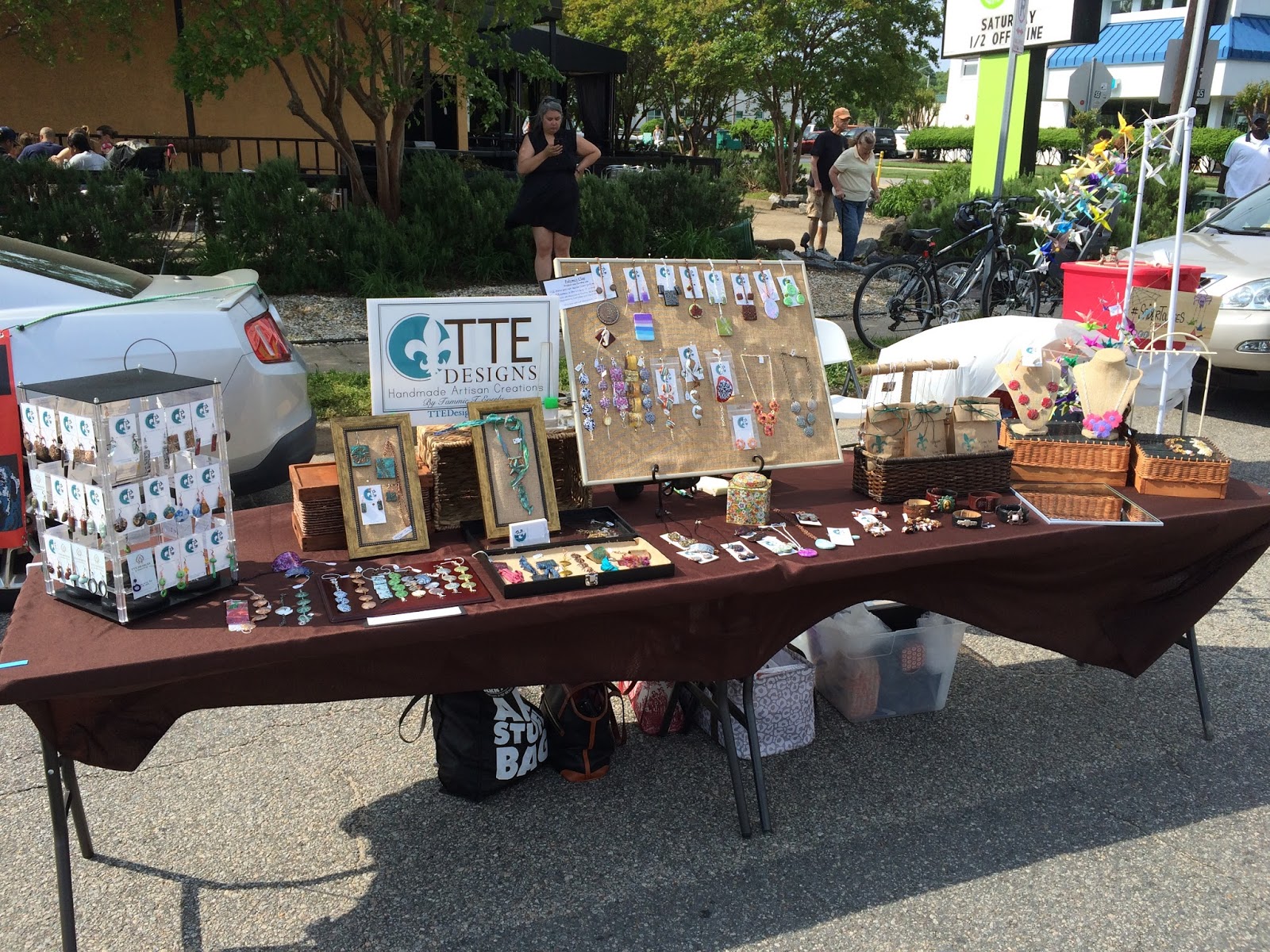Securing a Market Umbrella at an Outdoor Craft Show