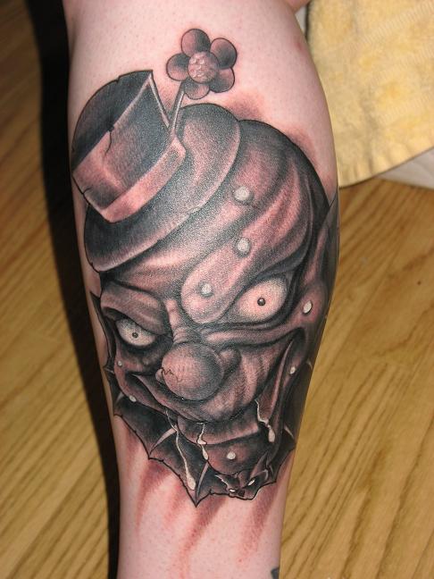 gangster clown tattoos. jester tattoo designs.