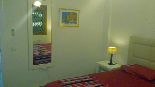 The main guest bedroom,alternate view showing the mirror. There are also built in wardrobes to the left of this view.
