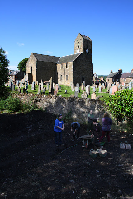 Our students opening one of the trenches outside St Serf's Parish Church, Dunning.