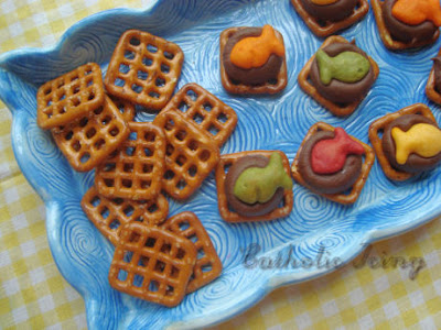 Rainbow Goldfish on pretzels with chocolate