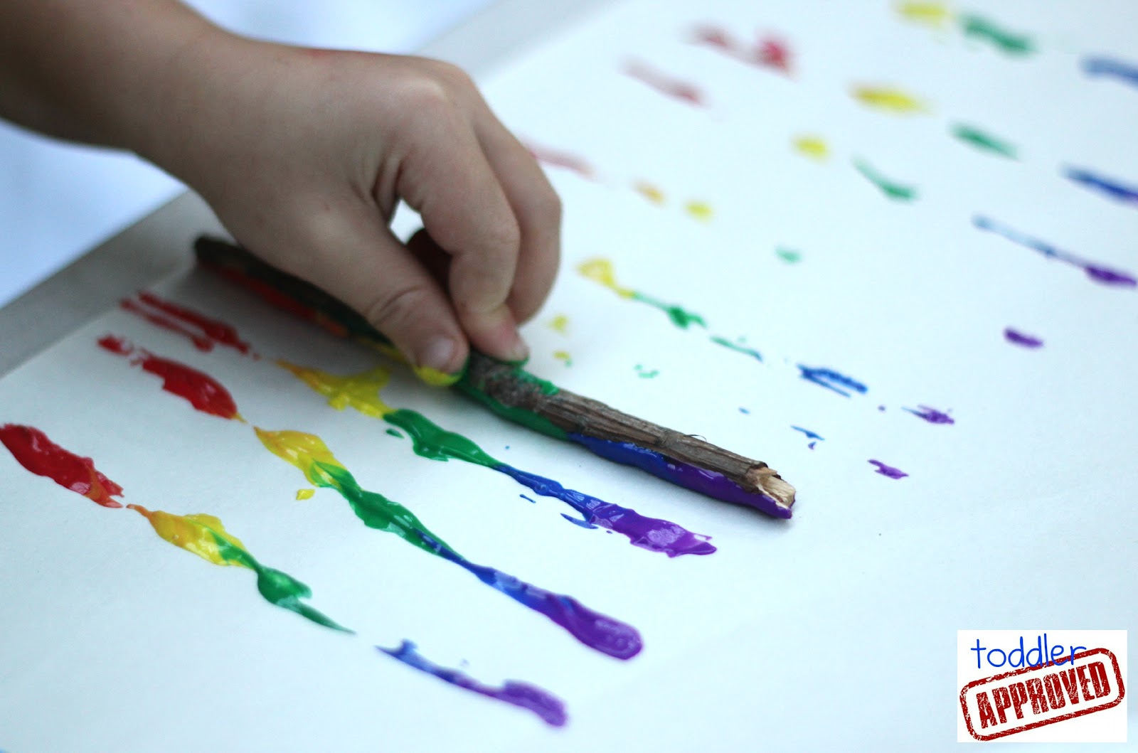 Toddler Approved! Rainbow Stick Painting
