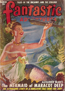 A woman as a giant mermaid, her torso naked but nipples covered by a water ripple, holds a submarine