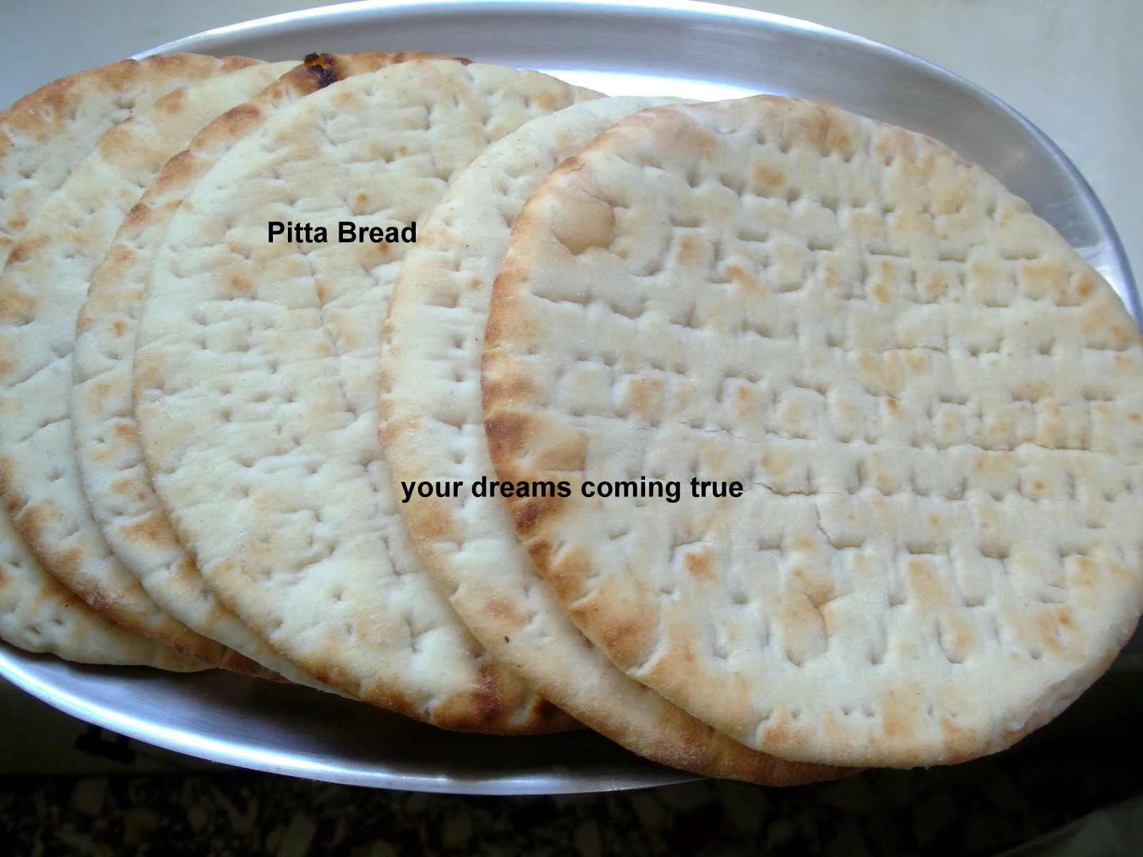 Chicken Tikka Kebabs With Cilantro, Raita On Pitta Bread.