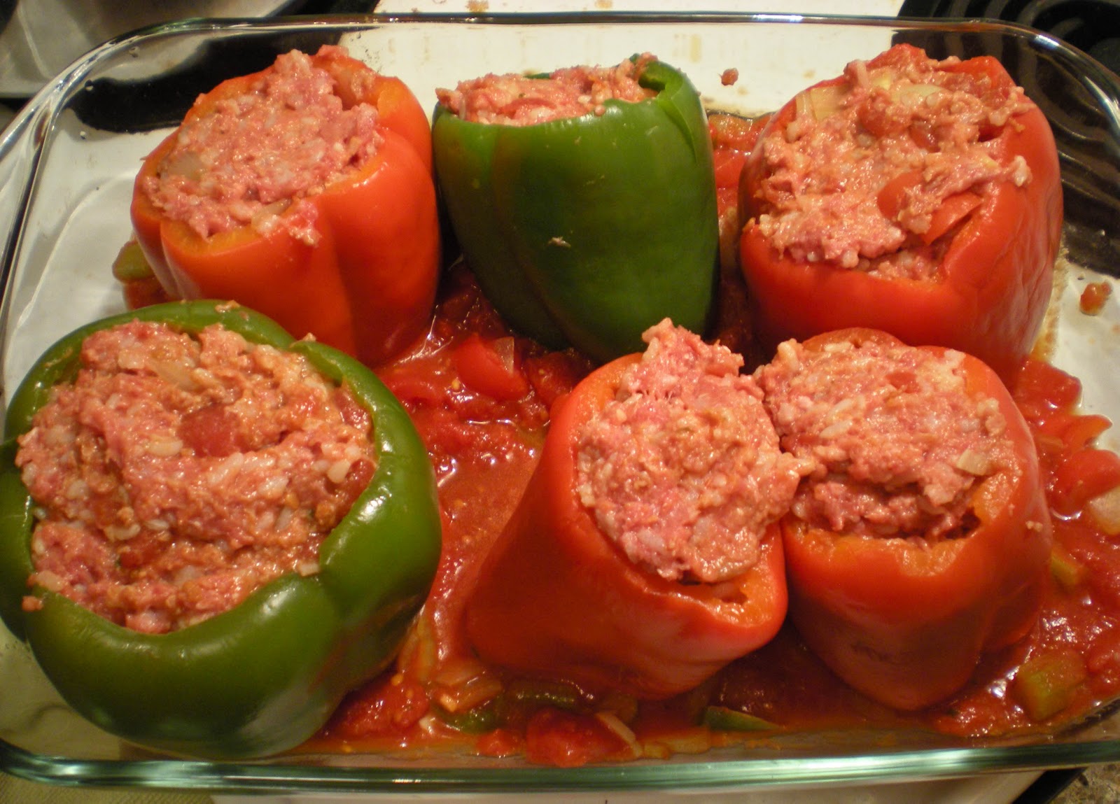 Random Cuisine Stuffed Bell Peppers on Marinara Sauce