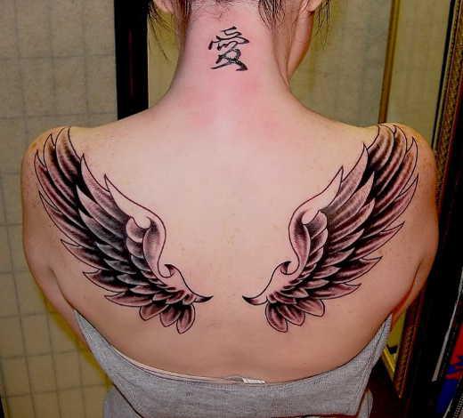 Simple but pretty angel feather tattoo on back 