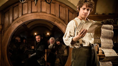 The Hobbit: An Unexpected Journey (2012) Martin Freeman as Bilbo Baggins in The Hobbit: An Unexpected Journey, as dwarves look on, directed by Peter Jackson