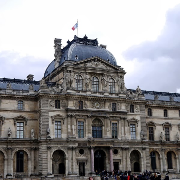 The Louvre and the French flag in Paris
