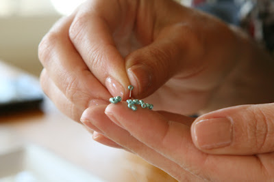 threading the seed beads on the necklace wire