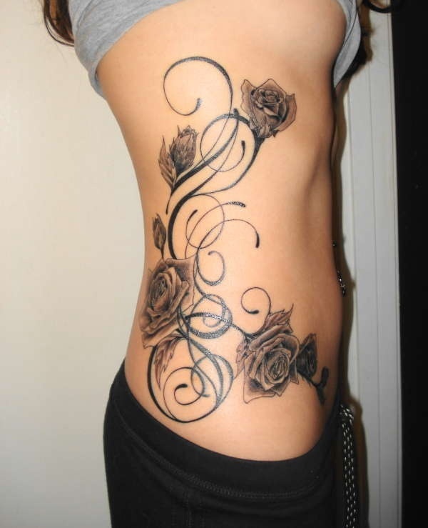 Design and Tattoo by Joey Pang flower side tattoos for women 