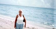 Lori standing on Hollywood beach