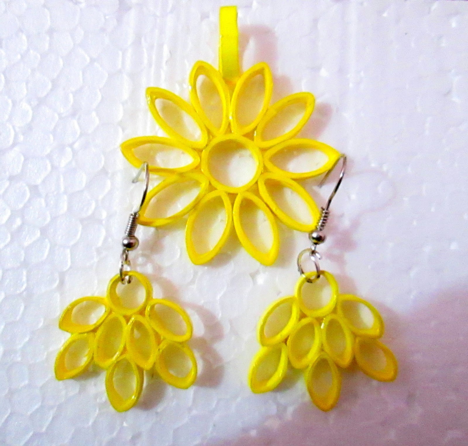 Hand Crafts by Anjali Vinod Quilled ear rings and Pendants