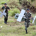 Lebanese Army soldiers carry parts of an Israeli drone  