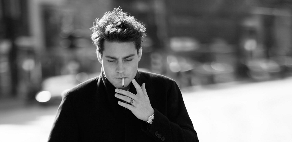 Douwe Bob smoking a cigarette (or weed)
