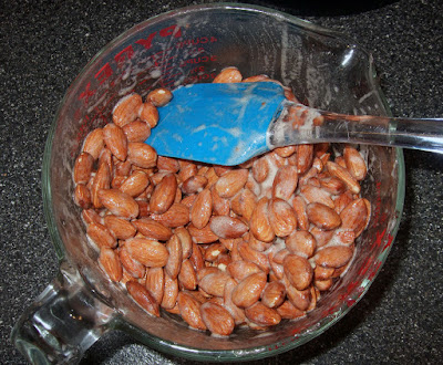 Almonds in egg white mixture.