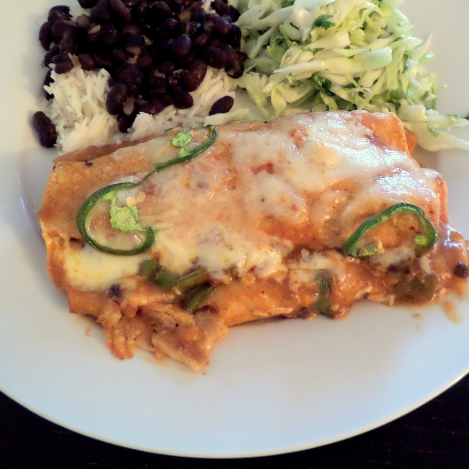 Chicken Enchiladas:  Corn tortillas rolled with chicken and cheese then smothered and baked in a chili sauce.