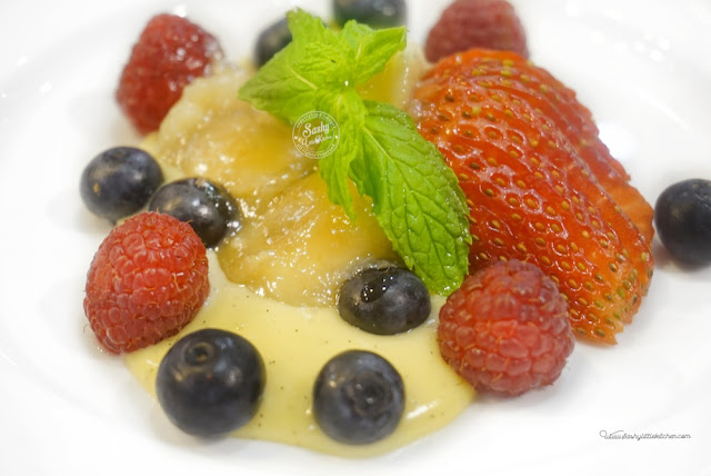 Madagascan Vanilla Bean Pudding, fresh berries and caramelized bananas Madagascan Vanilla Bean Pudding, fresh berries and caramelized bananas
