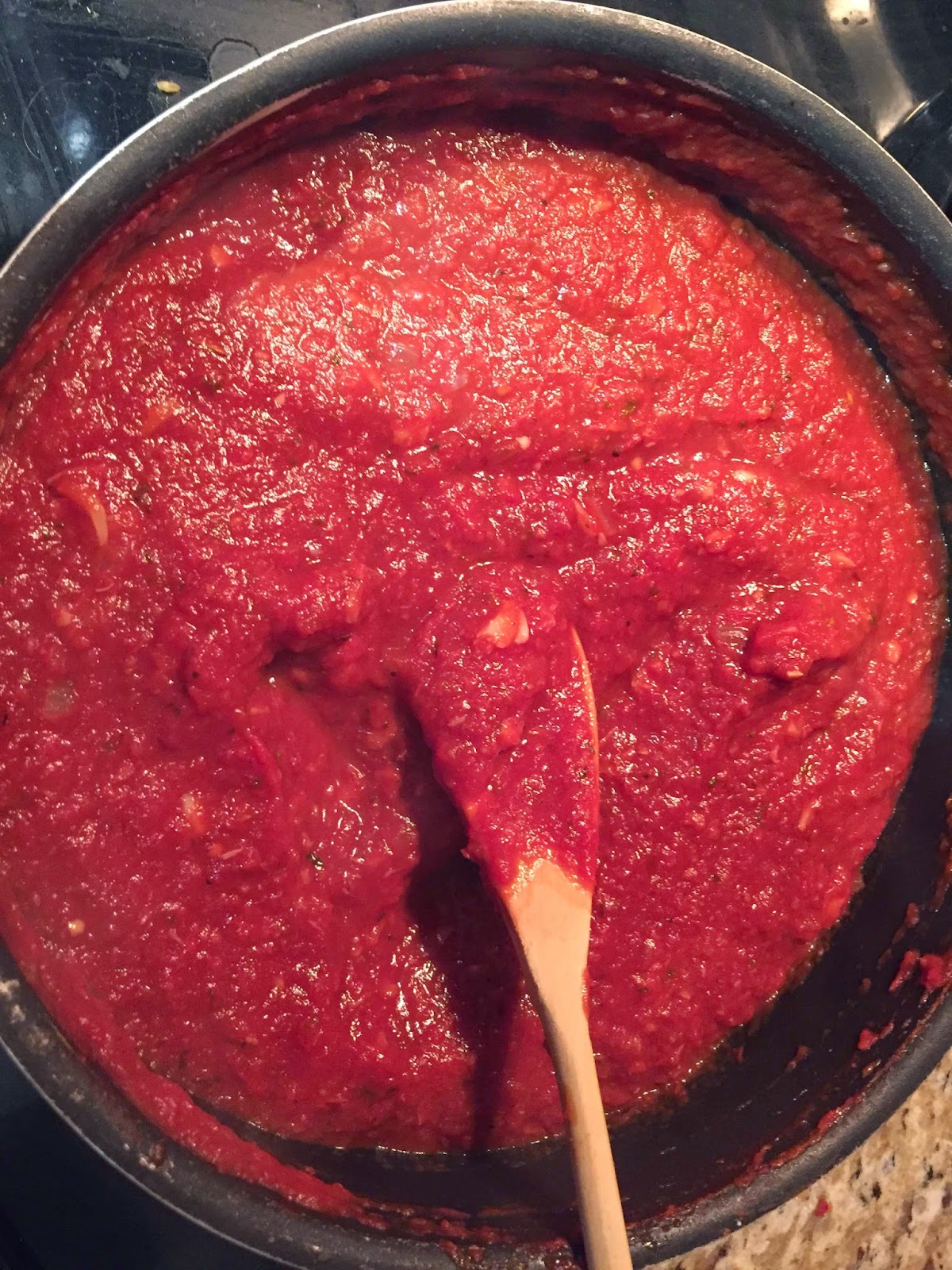 The Hungry Twenties Cooking pasta sauce with Tuttorosso