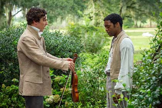 Benedict Cumberbatch and Chiwetel Ejiofor in 12 Years a Slave. Benedict Cumberbatch and Chiwetel Ejiofor in 12 Years a Slave.