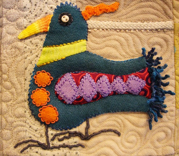 detail from Bird Dance by Sue Spargo, wool applique wall quilt