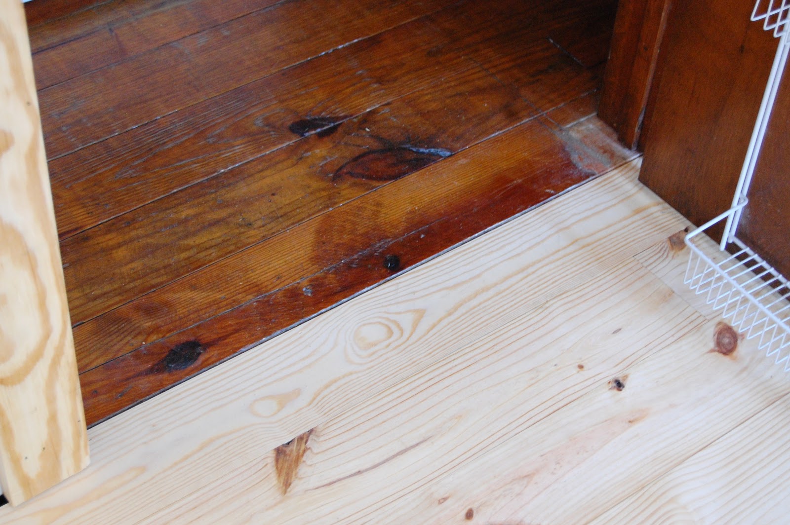 Kitchen utility cabinets yellow pine floors in the kitchen remodel by tidybrownwren.