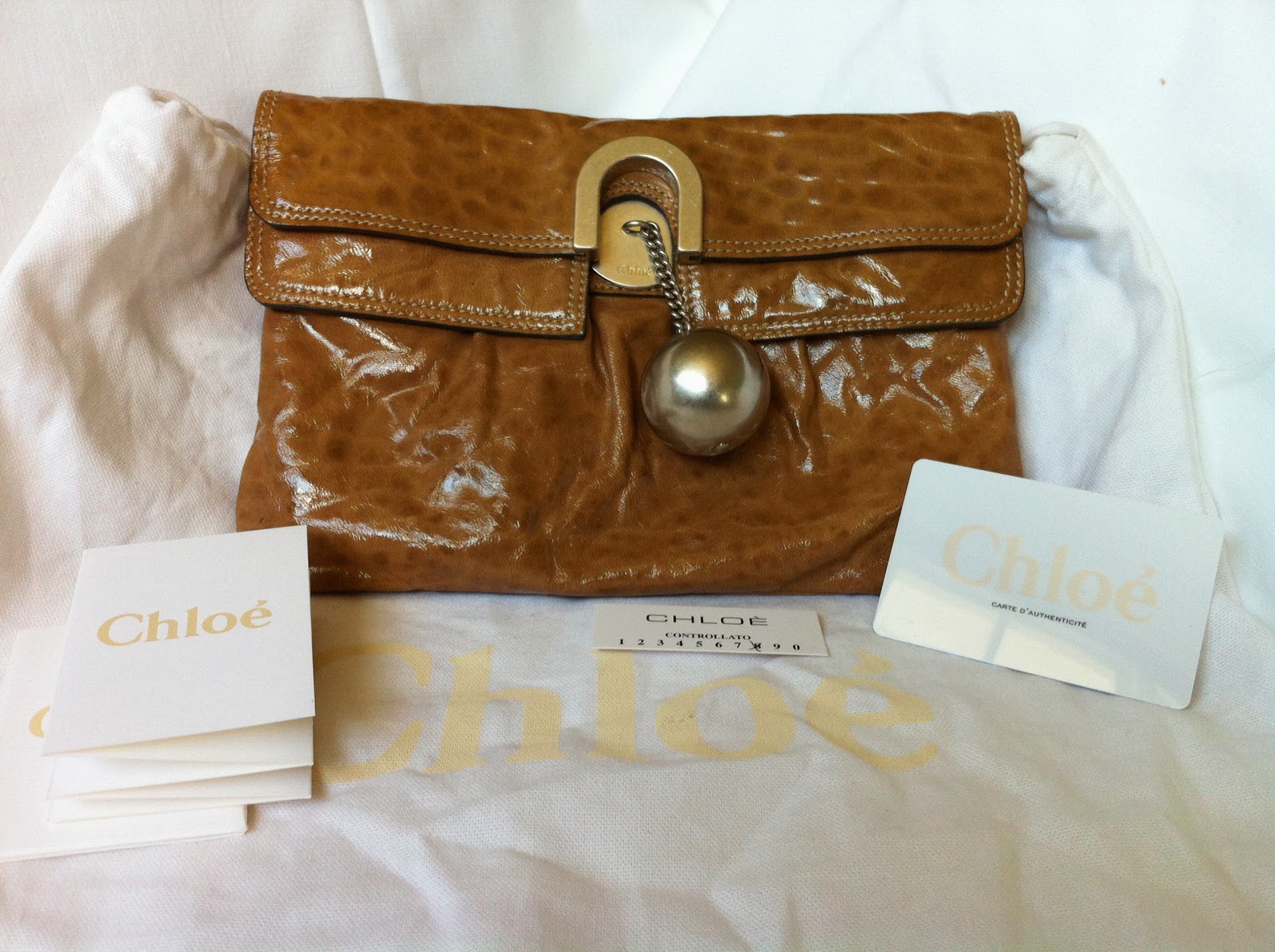 taupe patent leather clutch